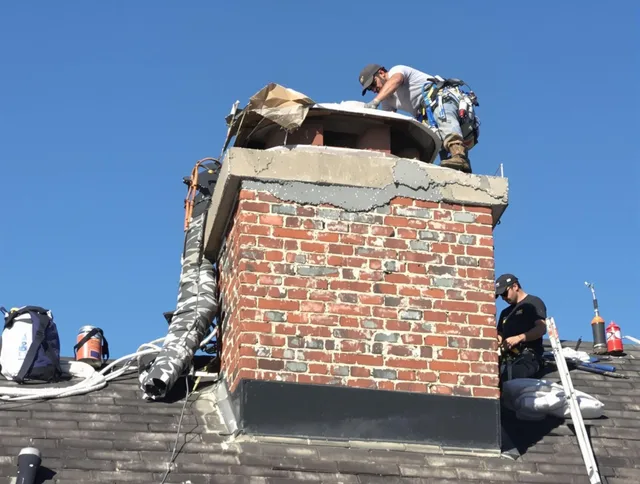 Redondo Beach Chimney Sweep installing a custom chimney crown in Redondo Beach, CA