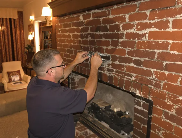 Redondo Beach Chimney Sweep expert fixing a fireplace in Redondo Beach, CA